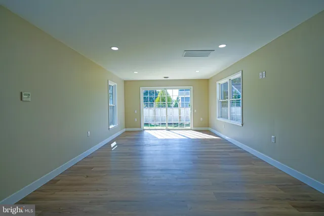 a bedroom with a bed and painting on the wall