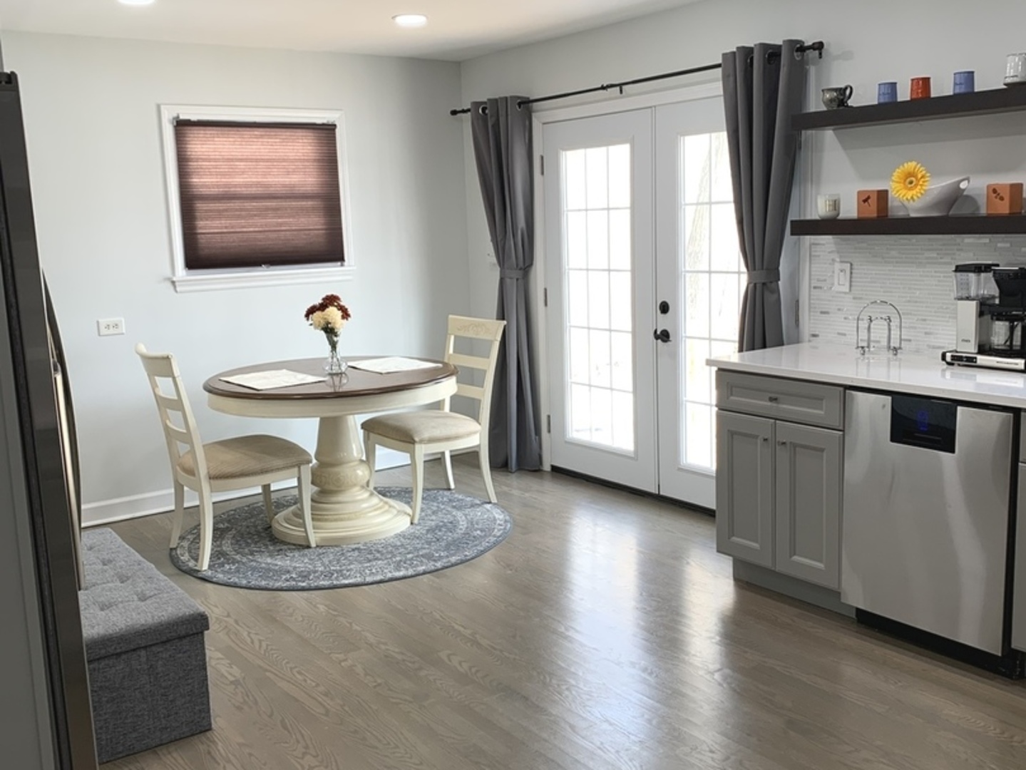 Undisclosed Address Mount Prospect, IL 60056 - Photo 11 of 14 a view of a kitchen area with furniture and wooden floor