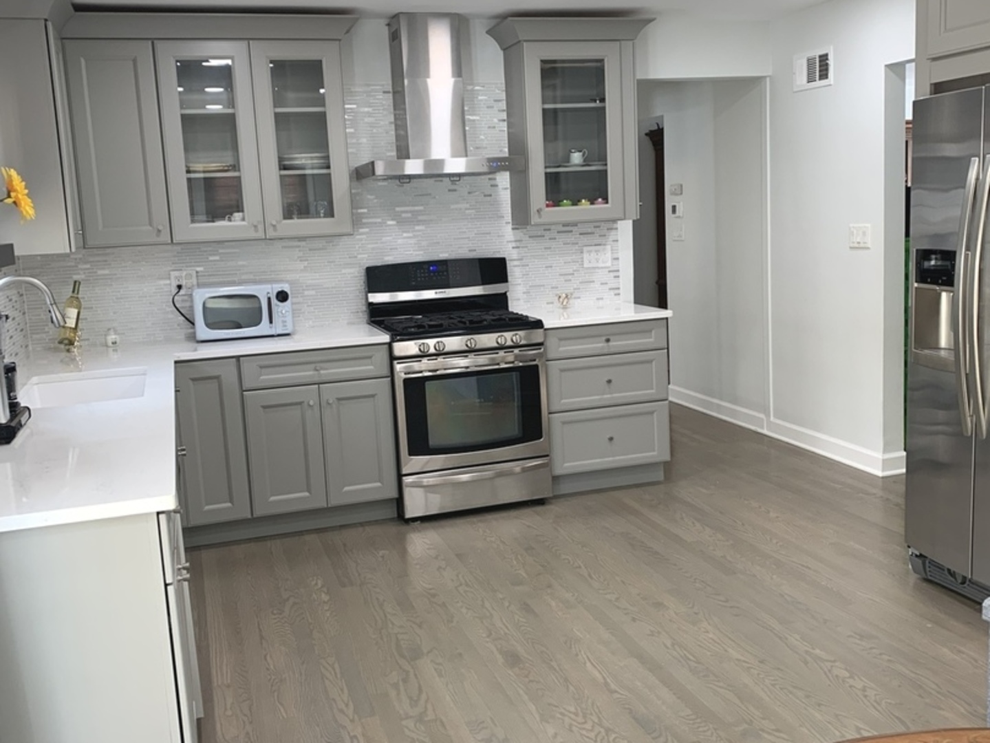 Undisclosed Address Mount Prospect, IL 60056 - Photo 12 of 14 a kitchen with stainless steel appliances granite countertop a stove a sink and a refrigerator