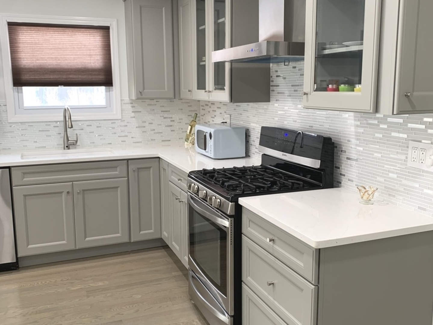 Undisclosed Address Mount Prospect, IL 60056 - Photo 8 of 14 a kitchen with a sink stove and cabinets