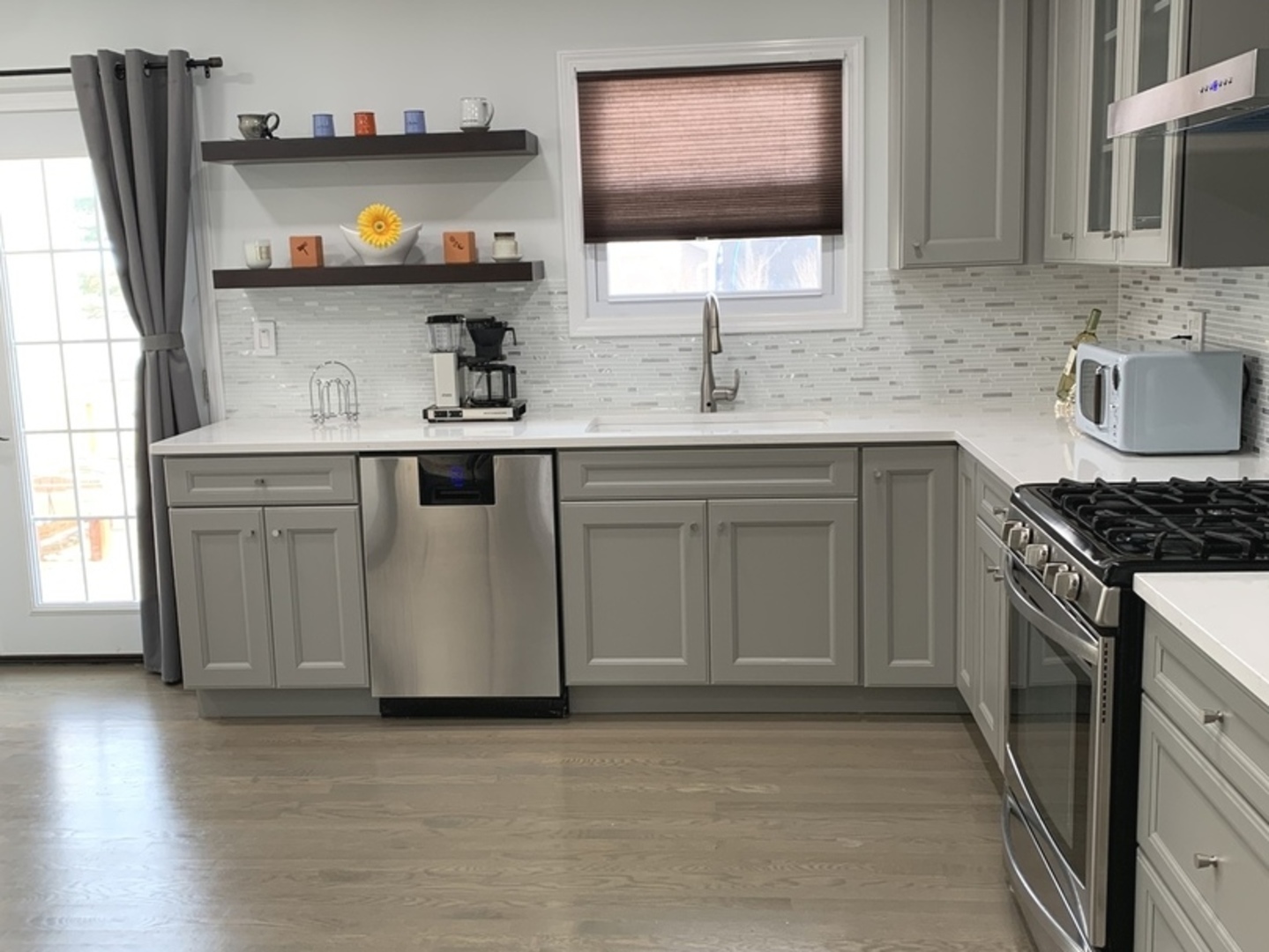 Undisclosed Address Mount Prospect, IL 60056 - Photo 10 of 14 a kitchen with stainless steel appliances granite countertop a sink and a stove