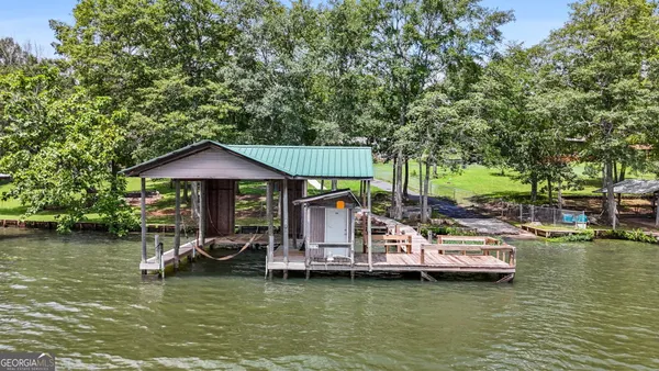 a view of a lake with boats and trees