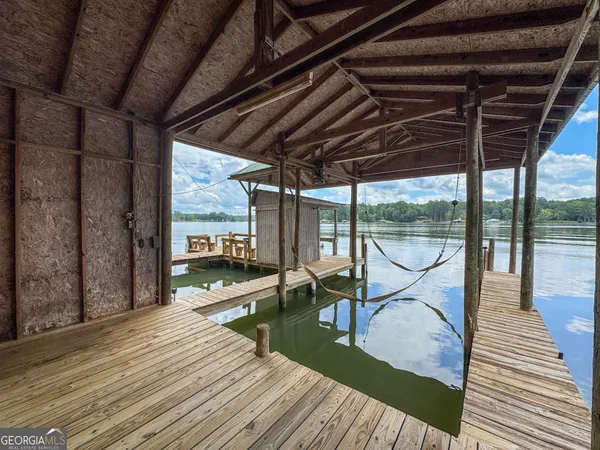 a view of a balcony with wooden floor