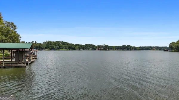 a view of a lake with houses in the background