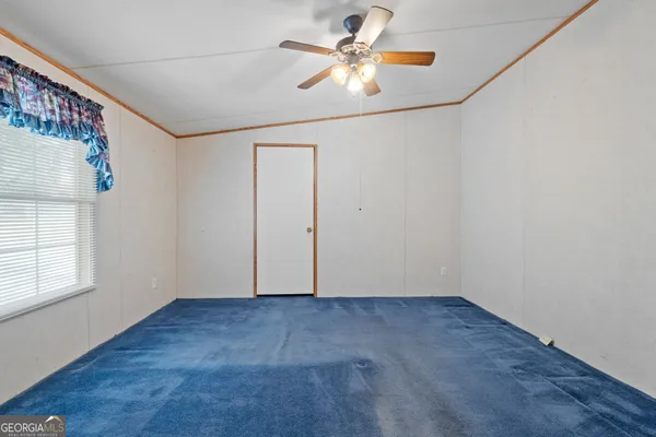 a very nice looking room with a large window and chandelier