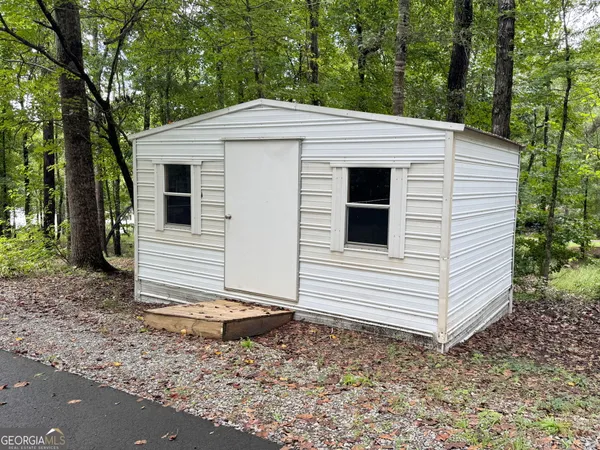 an aerial view of a houses with a lake view