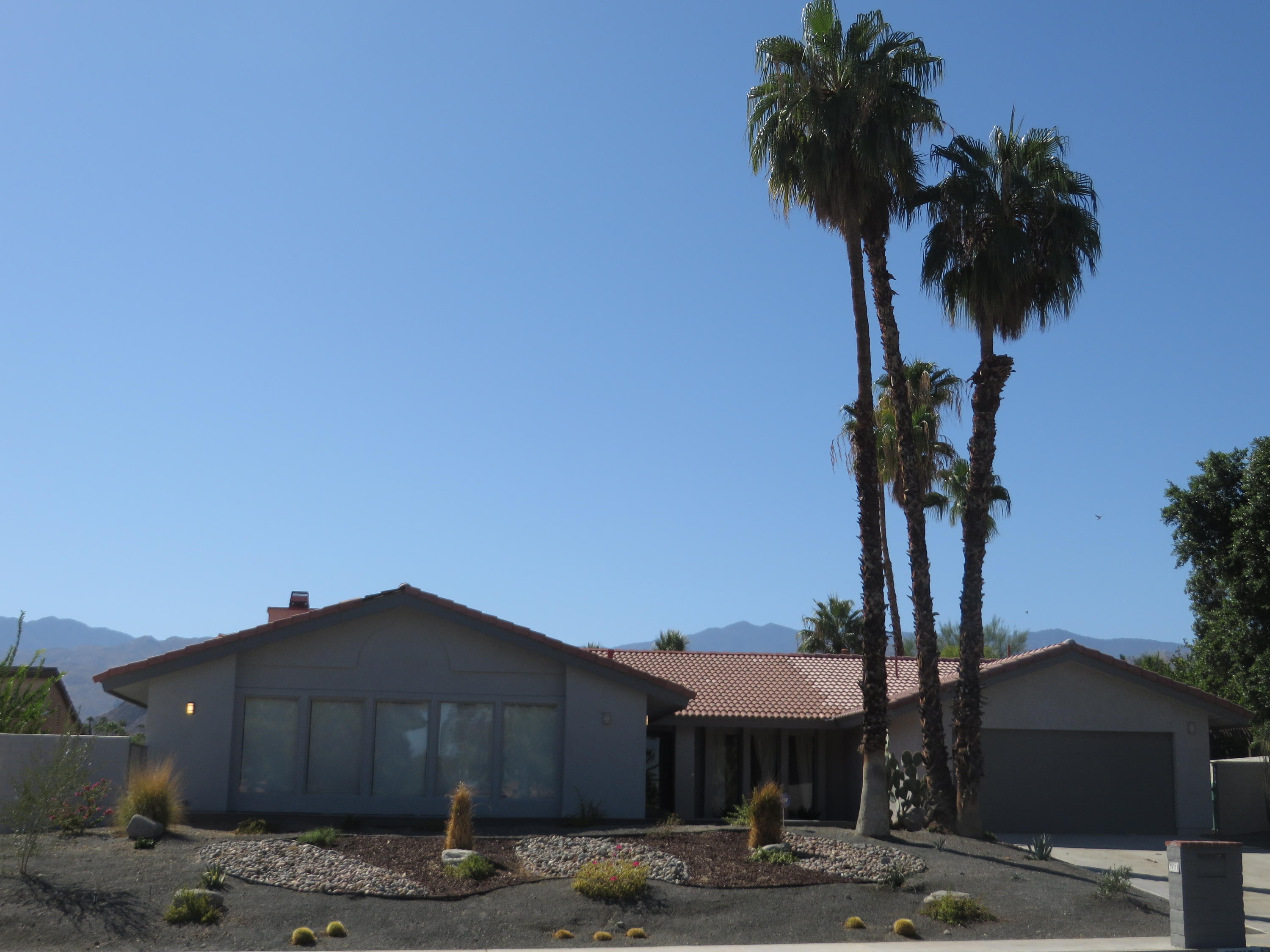 73315 Haystack Road Palm Desert, CA 92260 - Photo 2 of 32 a tree in front of a house