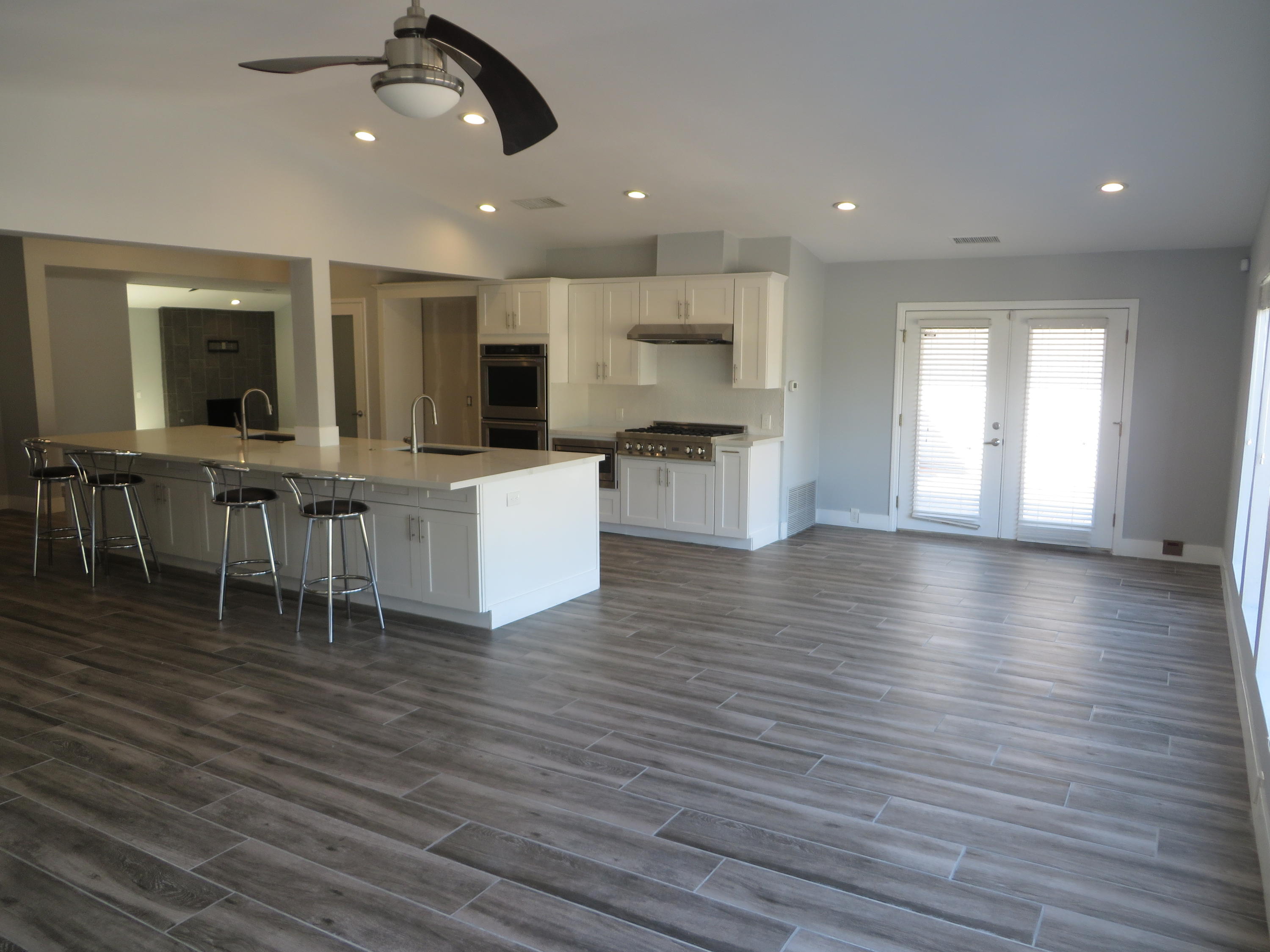 73315 Haystack Road Palm Desert, CA 92260 - Photo 13 of 32 a view of kitchen with cabinets and wooden floor