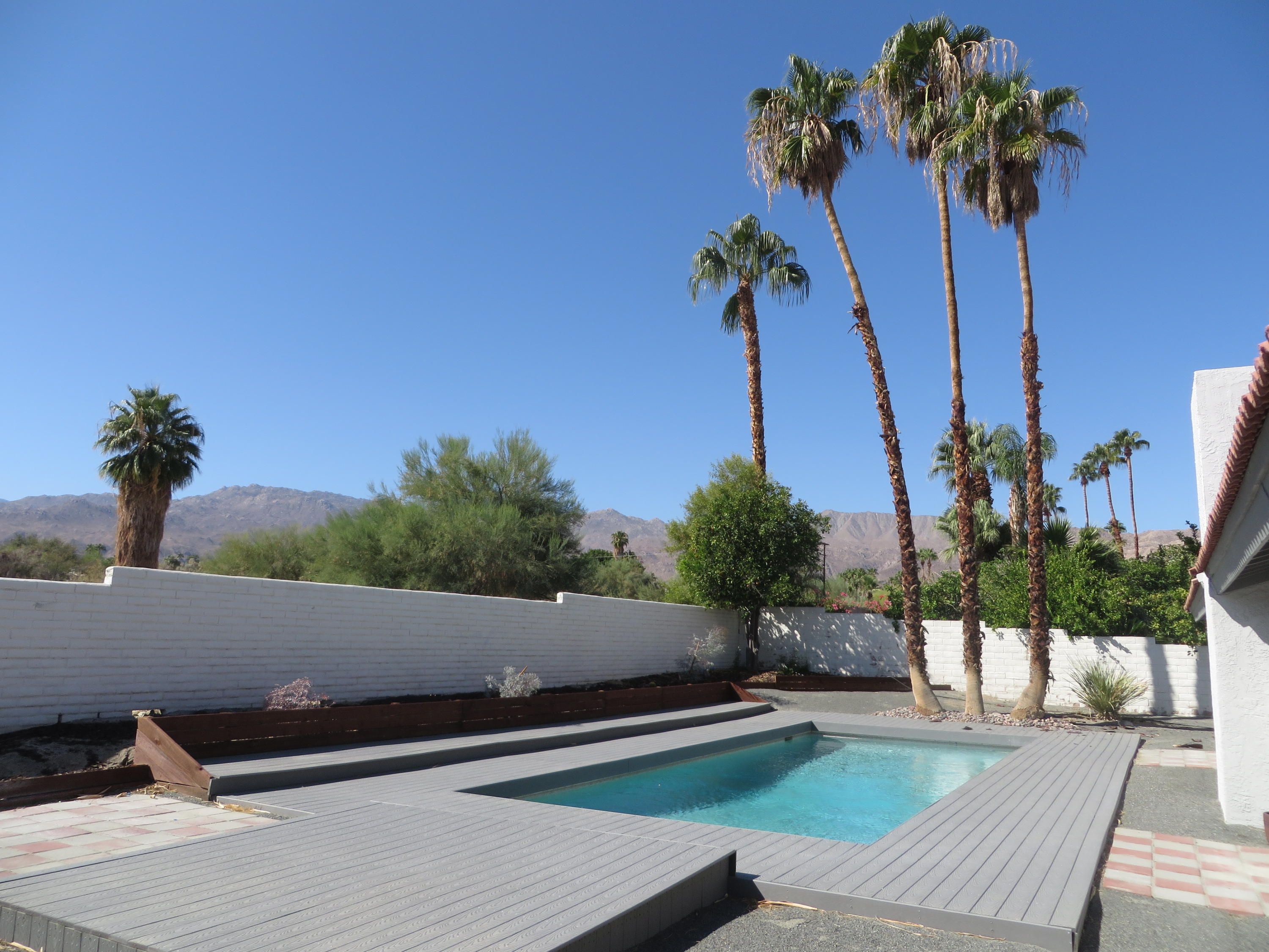 73315 Haystack Road Palm Desert, CA 92260 - Photo 26 of 32 a view of a terrace with a garden
