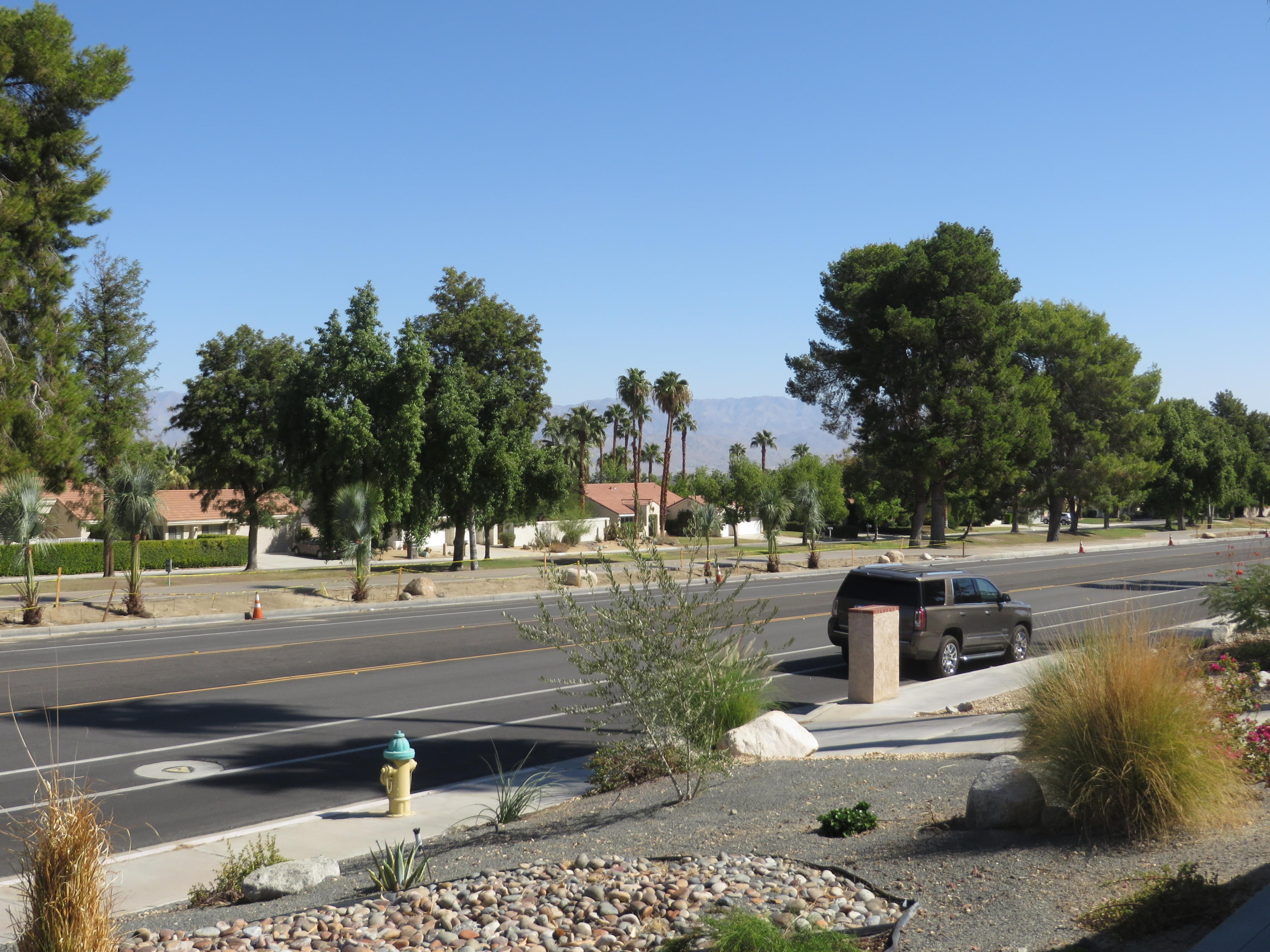 73315 Haystack Road Palm Desert, CA 92260 - Photo 29 of 32 a front view of a house with a yard