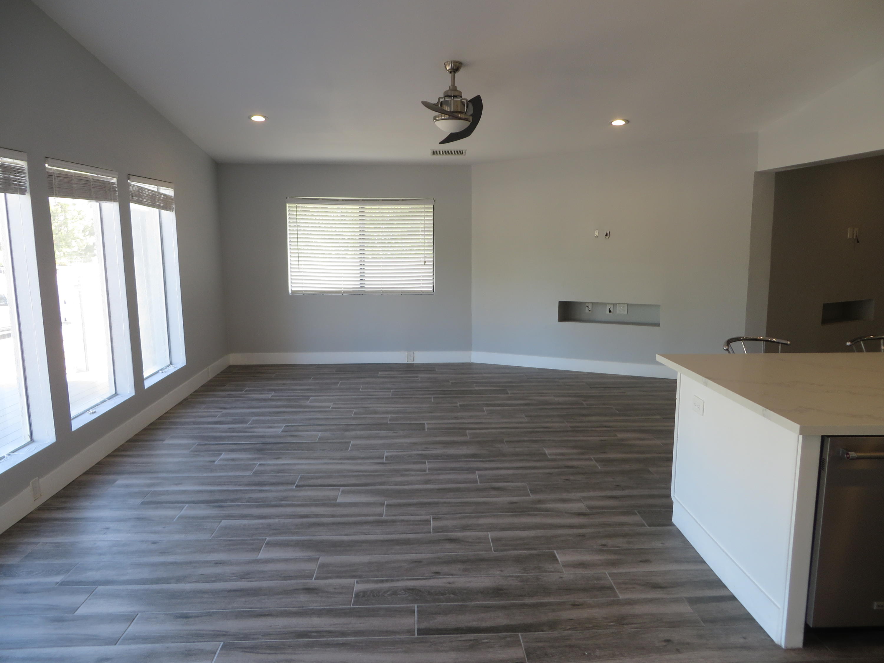 73315 Haystack Road Palm Desert, CA 92260 - Photo 9 of 32 a view of a kitchen with wooden floor and a sink