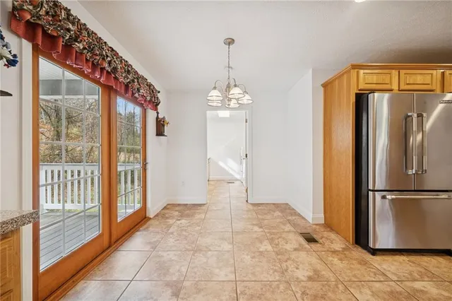 a very nice looking space with a large window and refrigerator