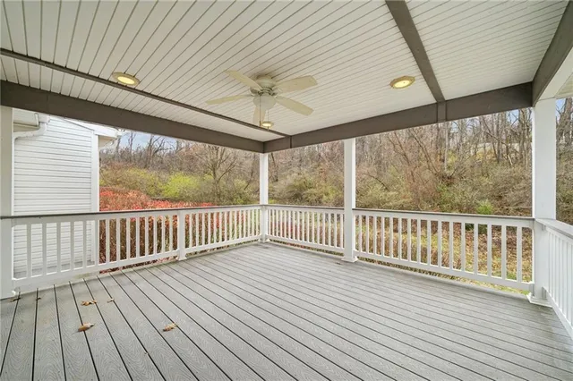 a view of balcony with wooden floor