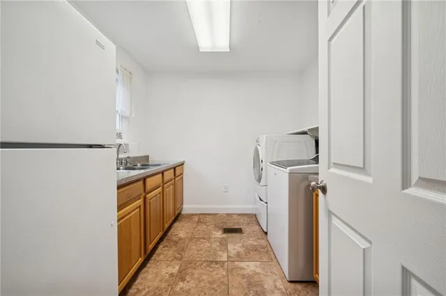 a hallway with washer and dryer