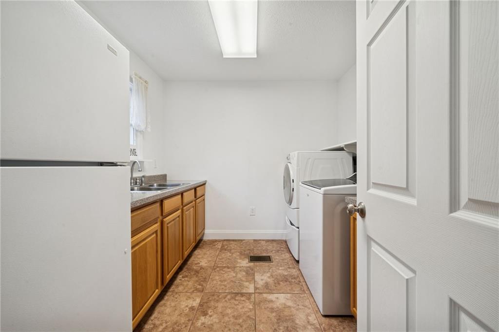 1619 Kennedy Road Imperial, PA 15126 - Photo 15 of 40 a hallway with washer and dryer