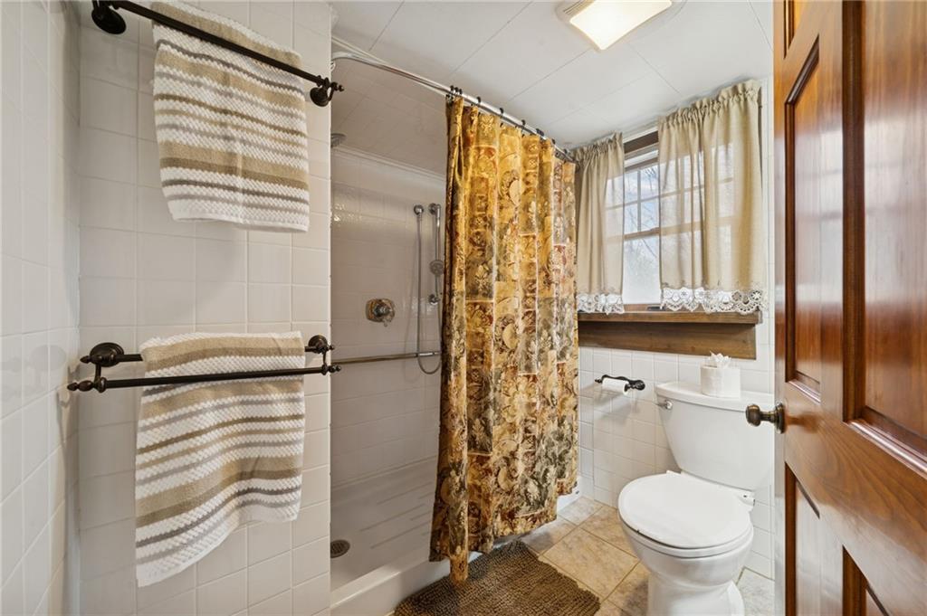 1619 Kennedy Road Imperial, PA 15126 - Photo 19 of 40 a bathroom with a granite countertop sink toilet and shower