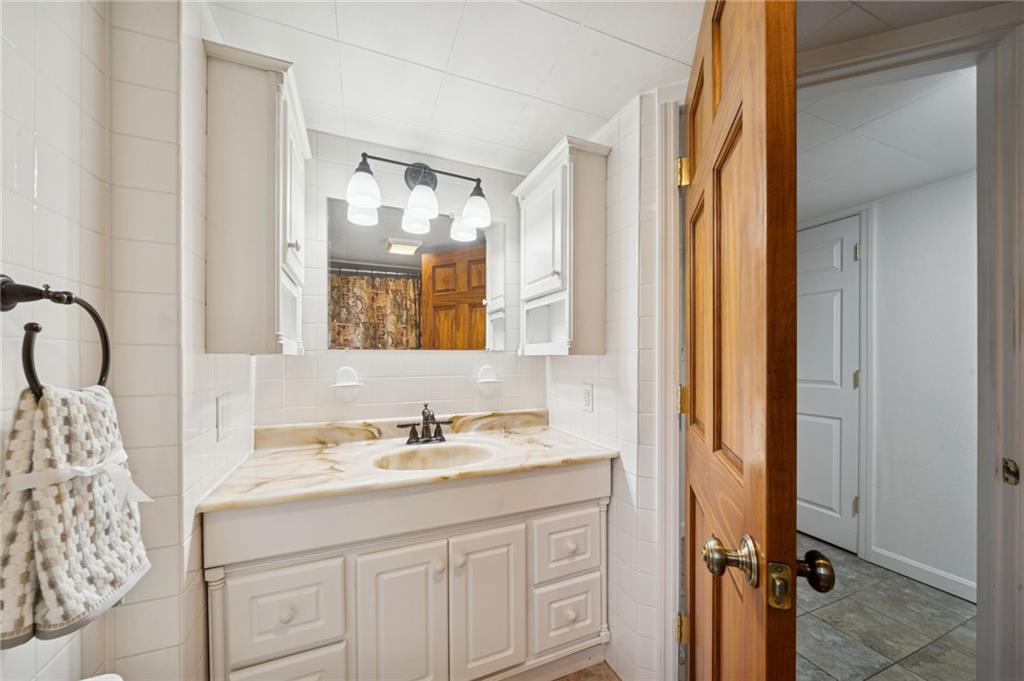 1619 Kennedy Road Imperial, PA 15126 - Photo 20 of 40 a bathroom with a sink and a mirror
