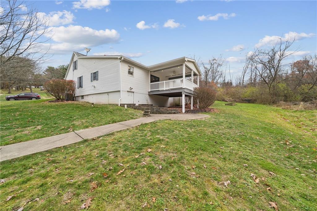 1619 Kennedy Road Imperial, PA 15126 - Photo 32 of 40 a view of a house with a backyard and a garden