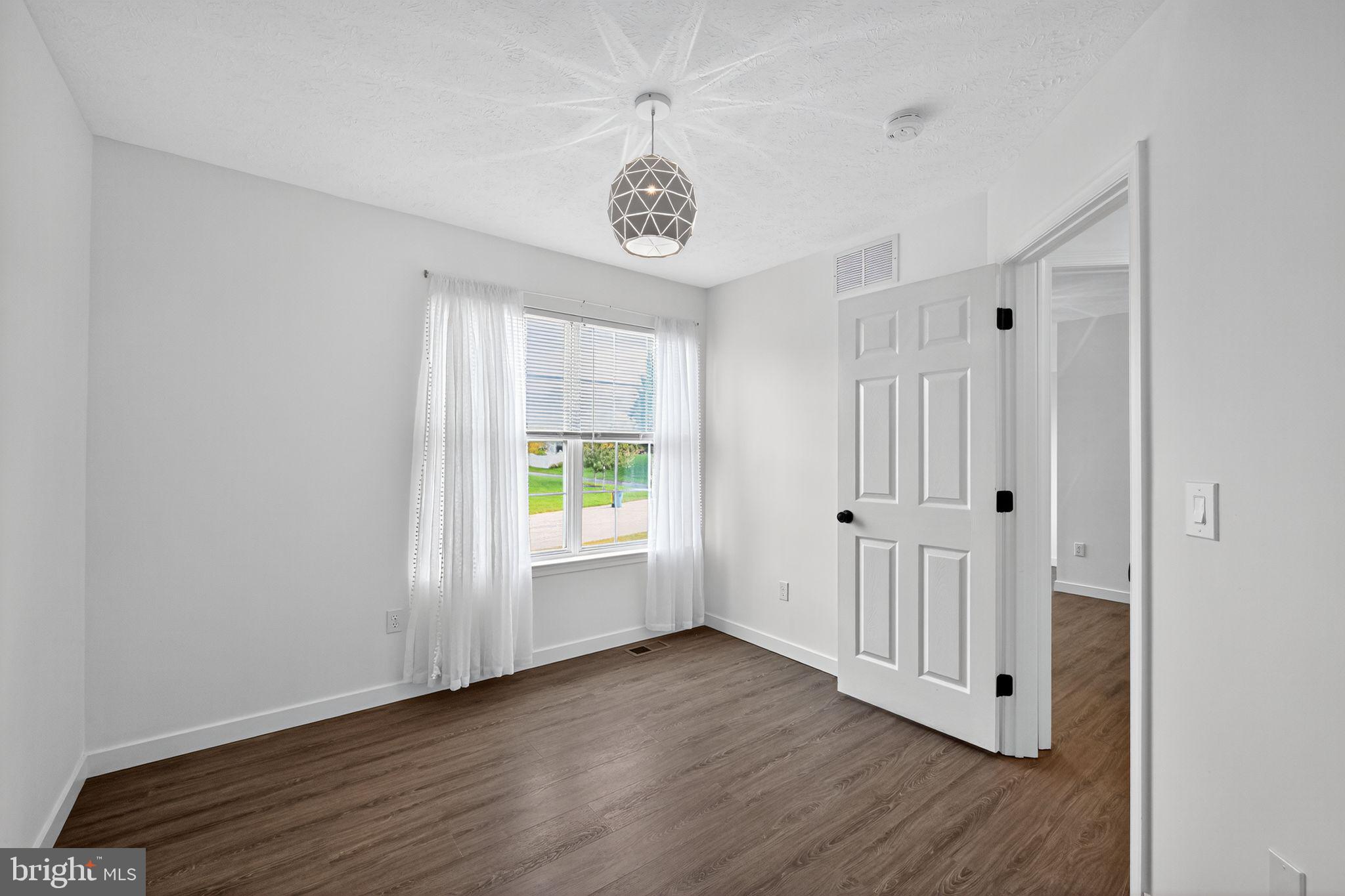 231 Cool Spring Lane Stewartstown, PA 17363 - Photo 12 of 27 a view of an entryway with wooden floor