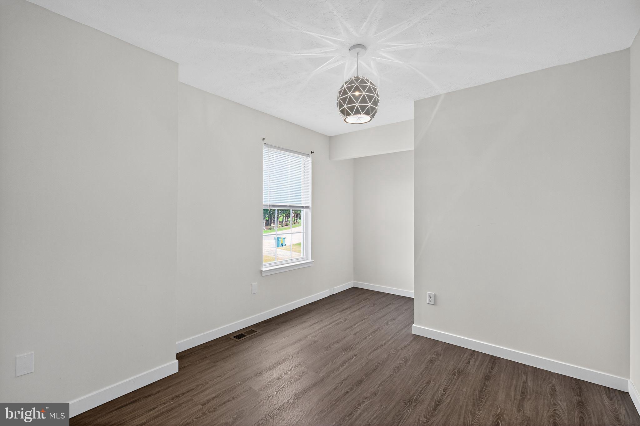 231 Cool Spring Lane Stewartstown, PA 17363 - Photo 13 of 27 an empty room with a window