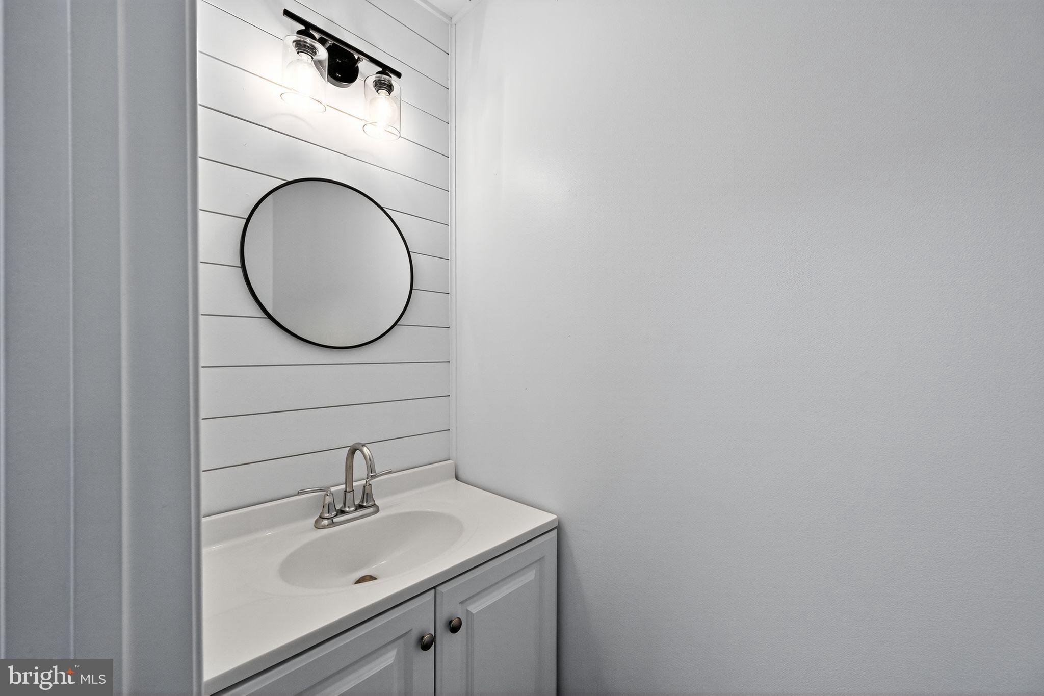 231 Cool Spring Lane Stewartstown, PA 17363 - Photo 15 of 27 a bathroom with a sink and a mirror