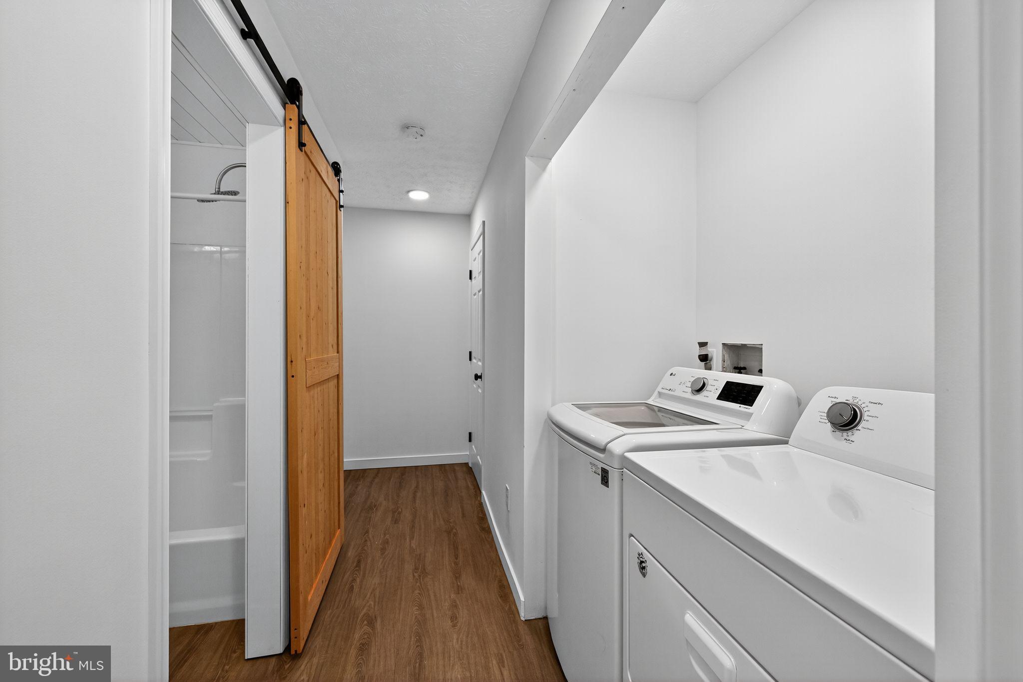 231 Cool Spring Lane Stewartstown, PA 17363 - Photo 18 of 27 a utility room with a sink dryer and washer