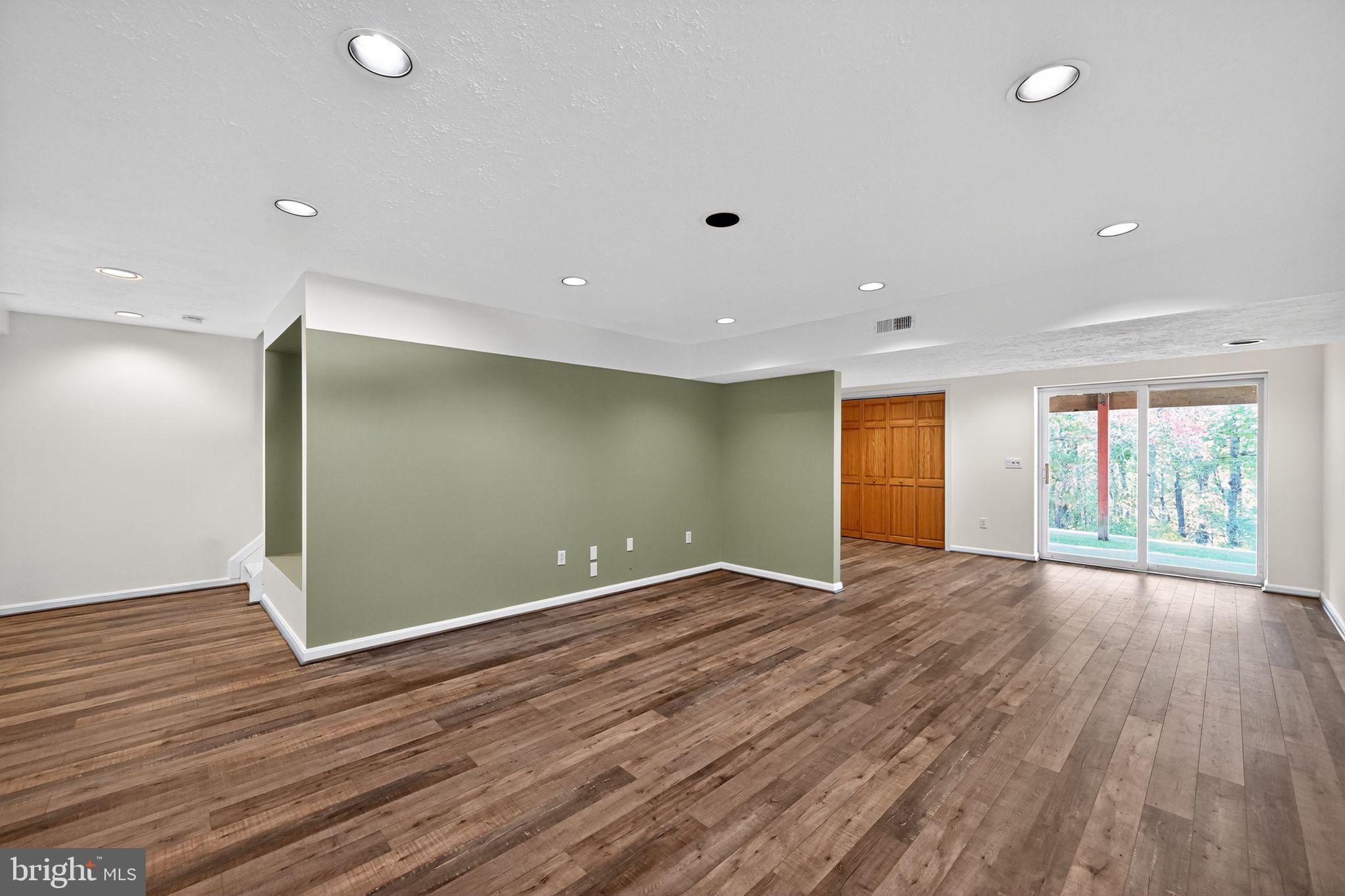 231 Cool Spring Lane Stewartstown, PA 17363 - Photo 20 of 27 an empty room with wooden floor and windows