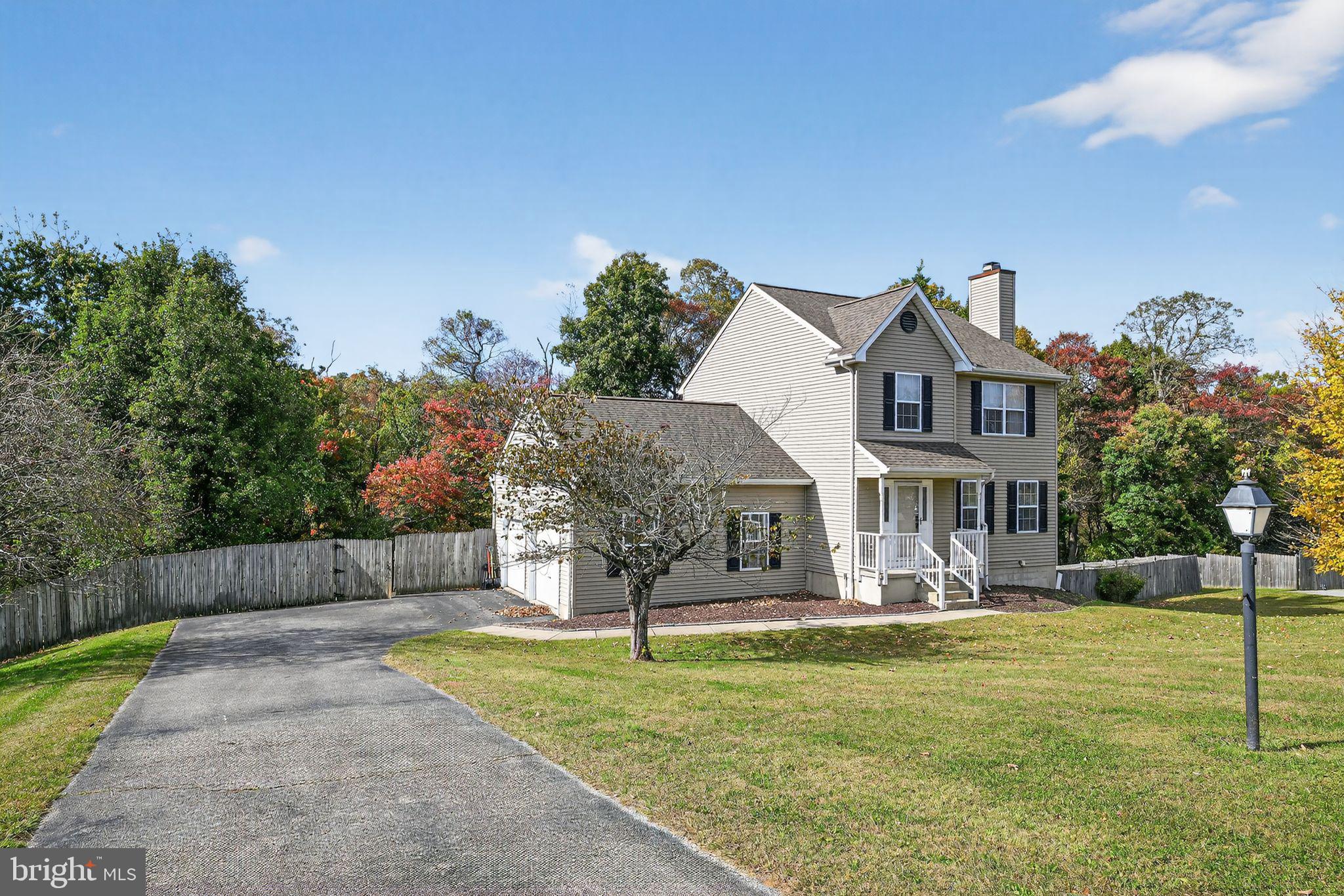 231 Cool Spring Lane Stewartstown, PA 17363 - Photo 2 of 27 a front view of a house with garden