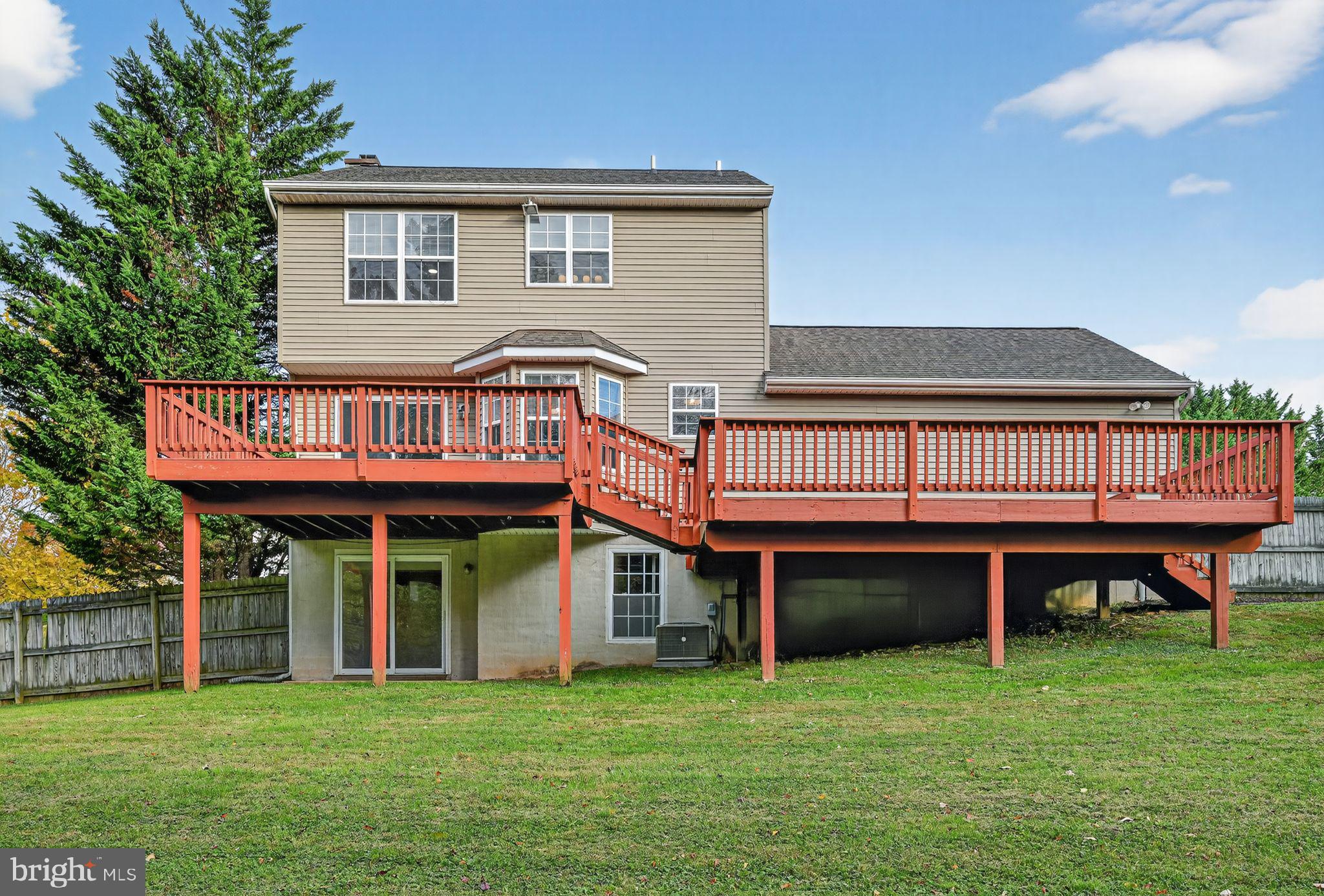 231 Cool Spring Lane Stewartstown, PA 17363 - Photo 23 of 27 a view of a house with a yard and deck
