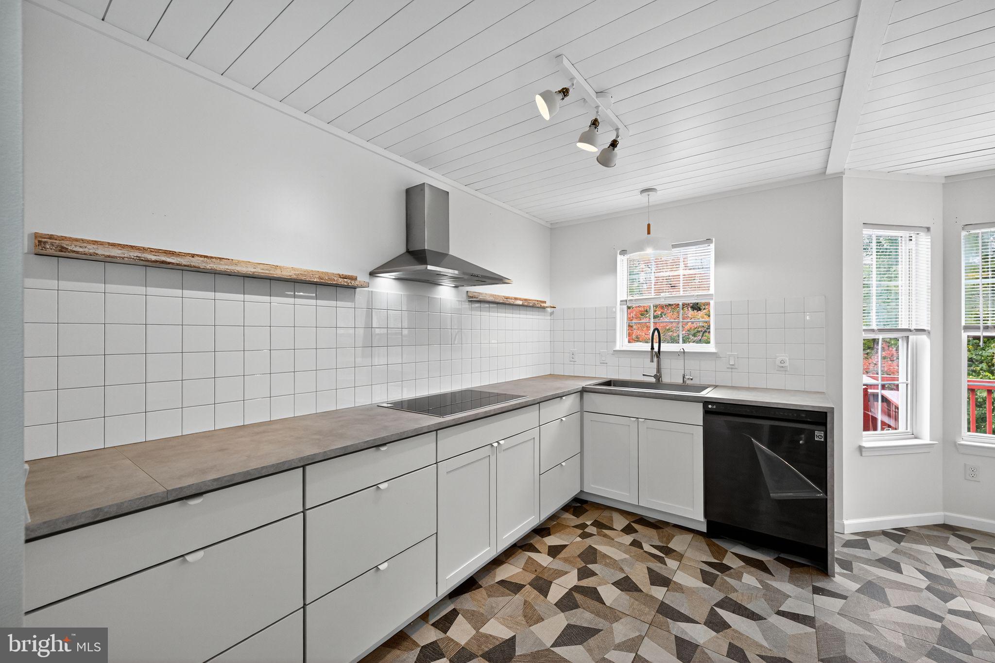 231 Cool Spring Lane Stewartstown, PA 17363 - Photo 8 of 27 a kitchen with stainless steel appliances granite countertop a sink and cabinets