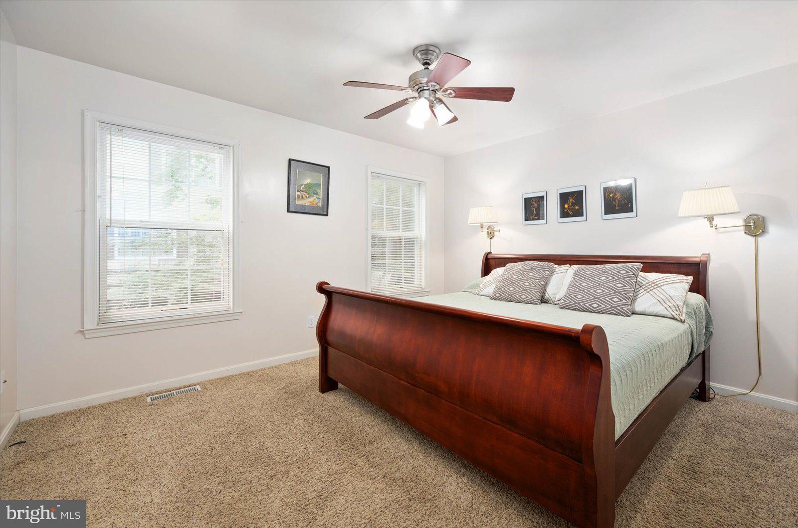 156 Sandyhook Road Berlin, MD 21811 - Photo 17 of 95 a spacious bedroom with a bed and window
