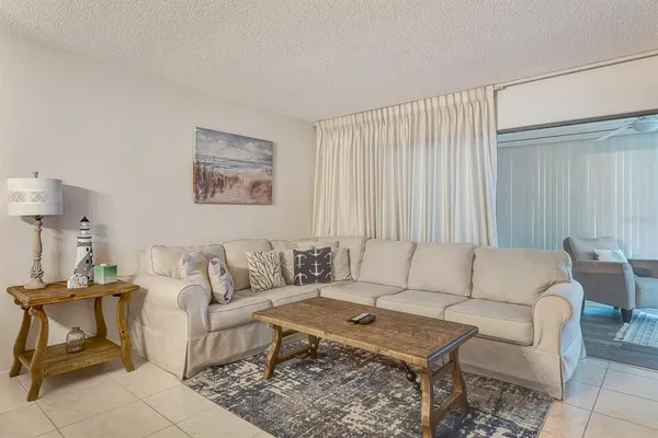 a living room with furniture and a rug