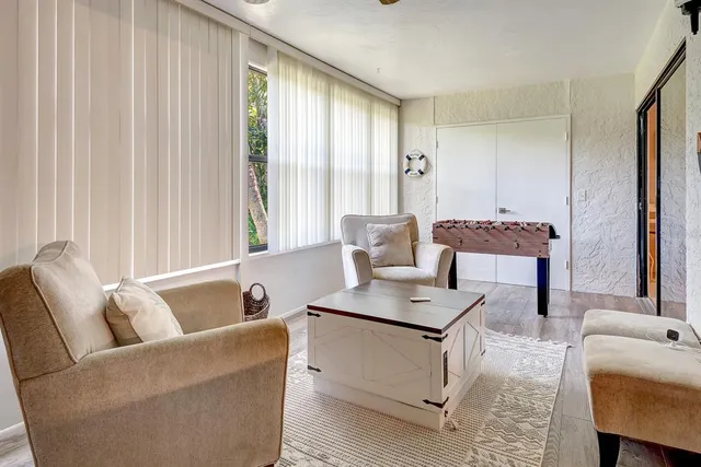 a bedroom with furniture and a flat screen tv