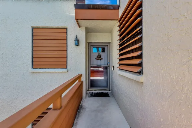 a kitchen with granite countertop a stove a sink and a refrigerator
