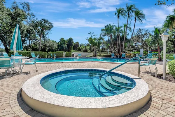 a view of a swimming pool with a yard