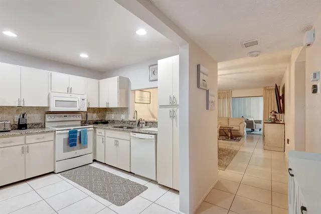 a view of a dining area with furniture and a chandelier