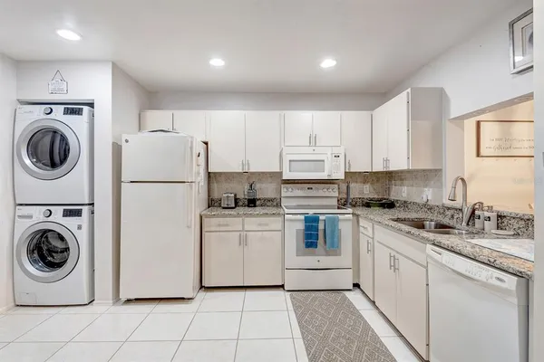 a kitchen with cabinets and steel stainless steel appliances