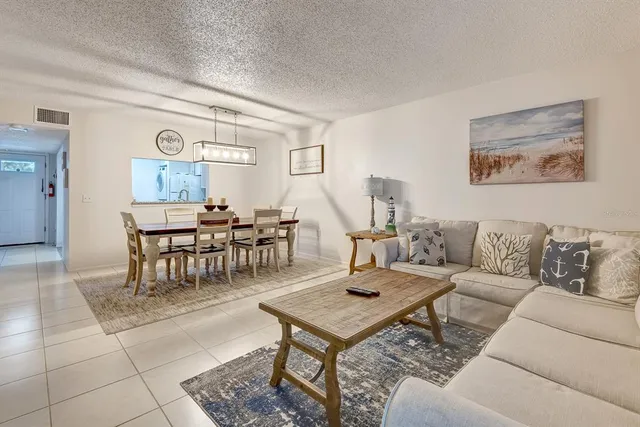 a bathroom with a granite countertop sink toilet and a mirror