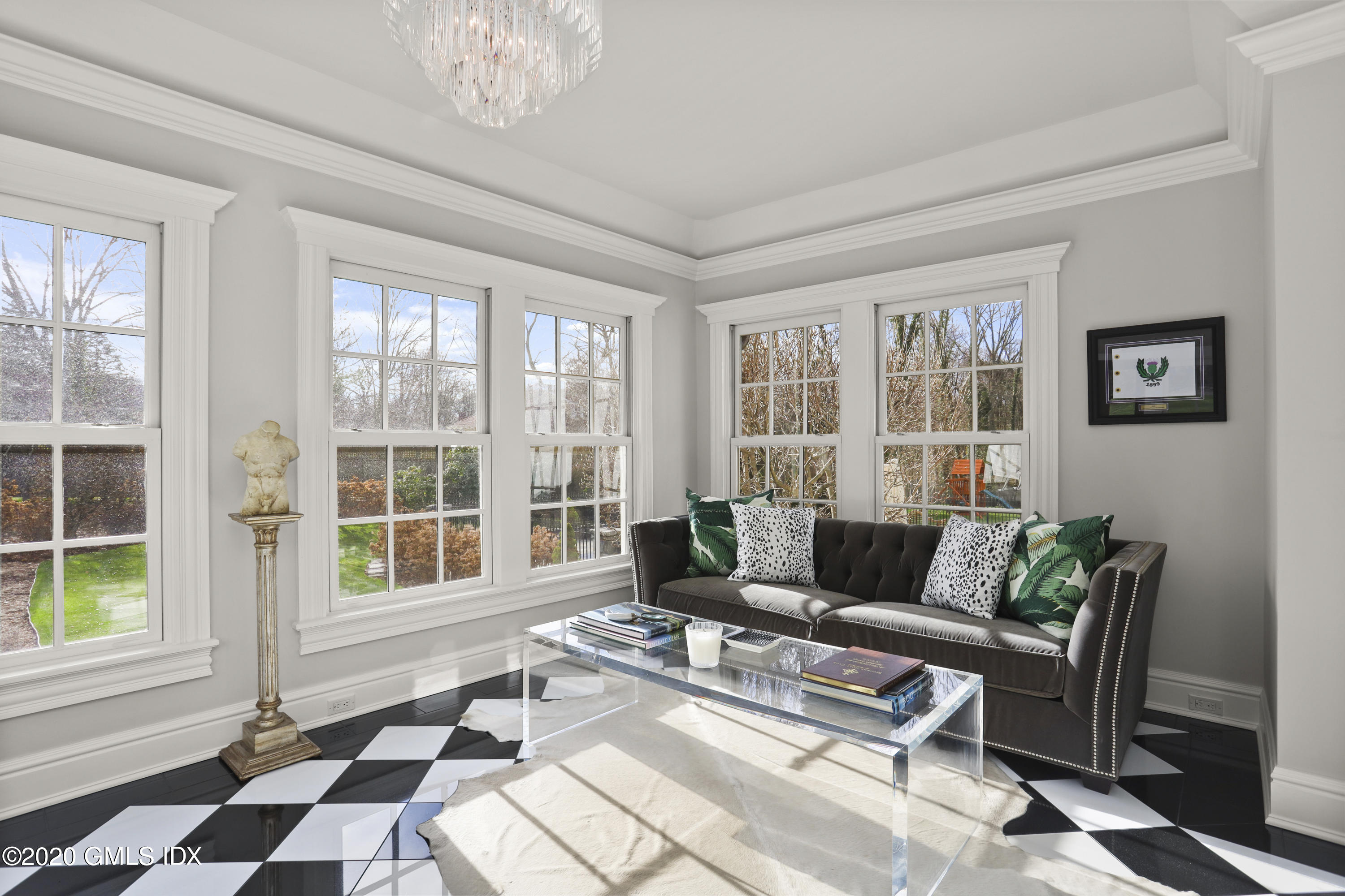 10 Brookridge Drive Greenwich, CT 06830 - Photo 11 of 36 a living room with furniture and floor to ceiling windows