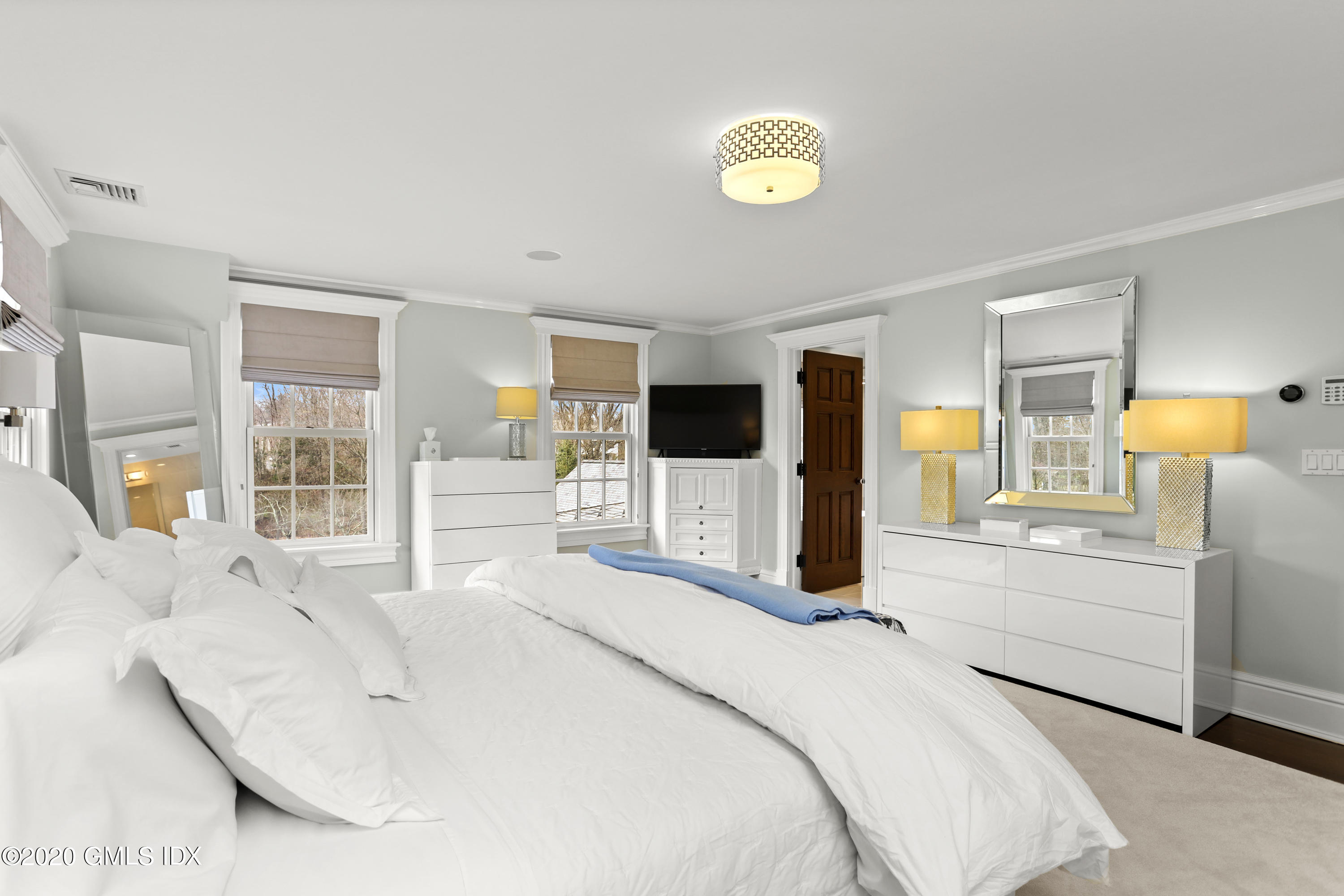 10 Brookridge Drive Greenwich, CT 06830 - Photo 13 of 36 a bedroom with a bed and window