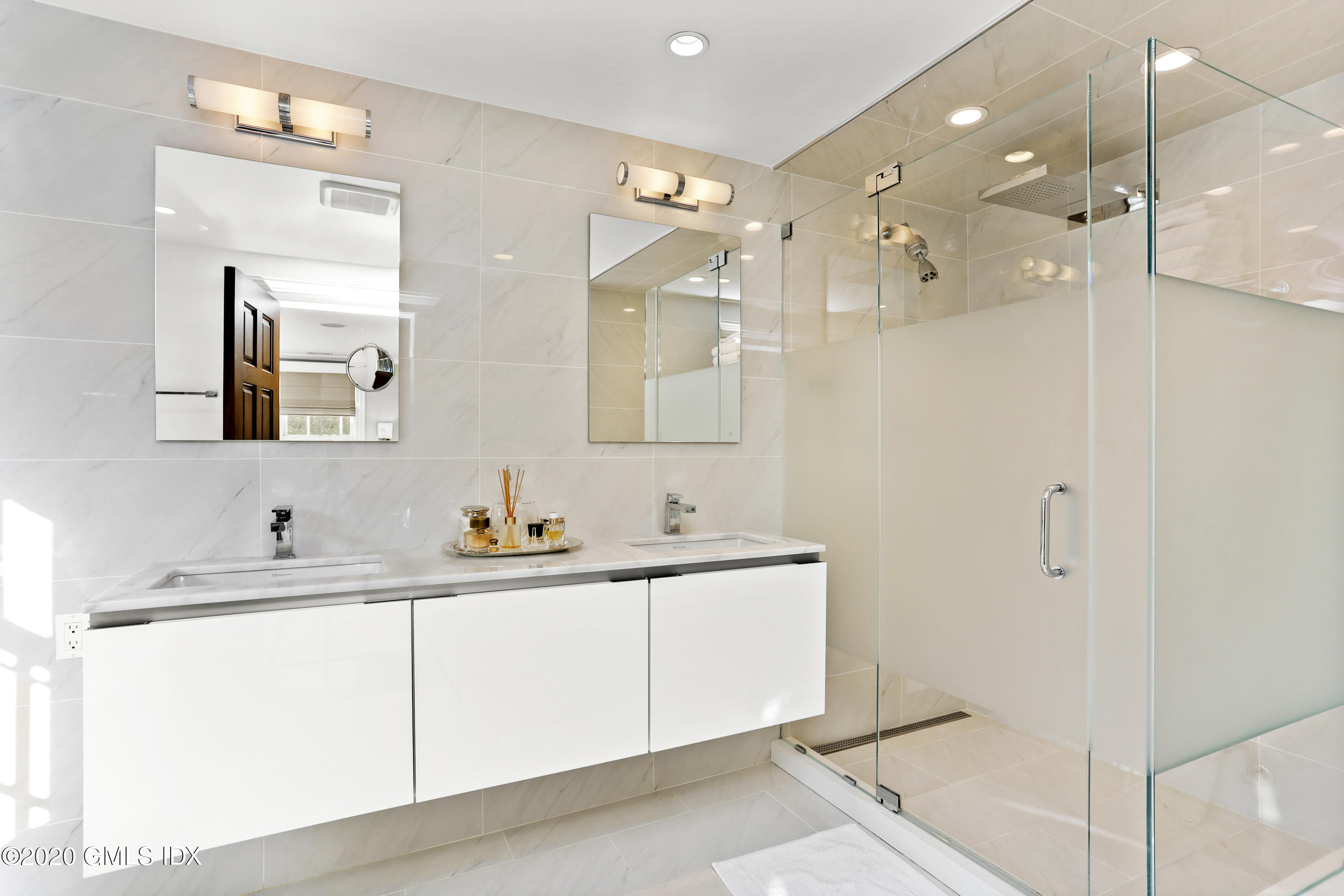 10 Brookridge Drive Greenwich, CT 06830 - Photo 14 of 36 a bathroom with a double vanity sink mirror and double