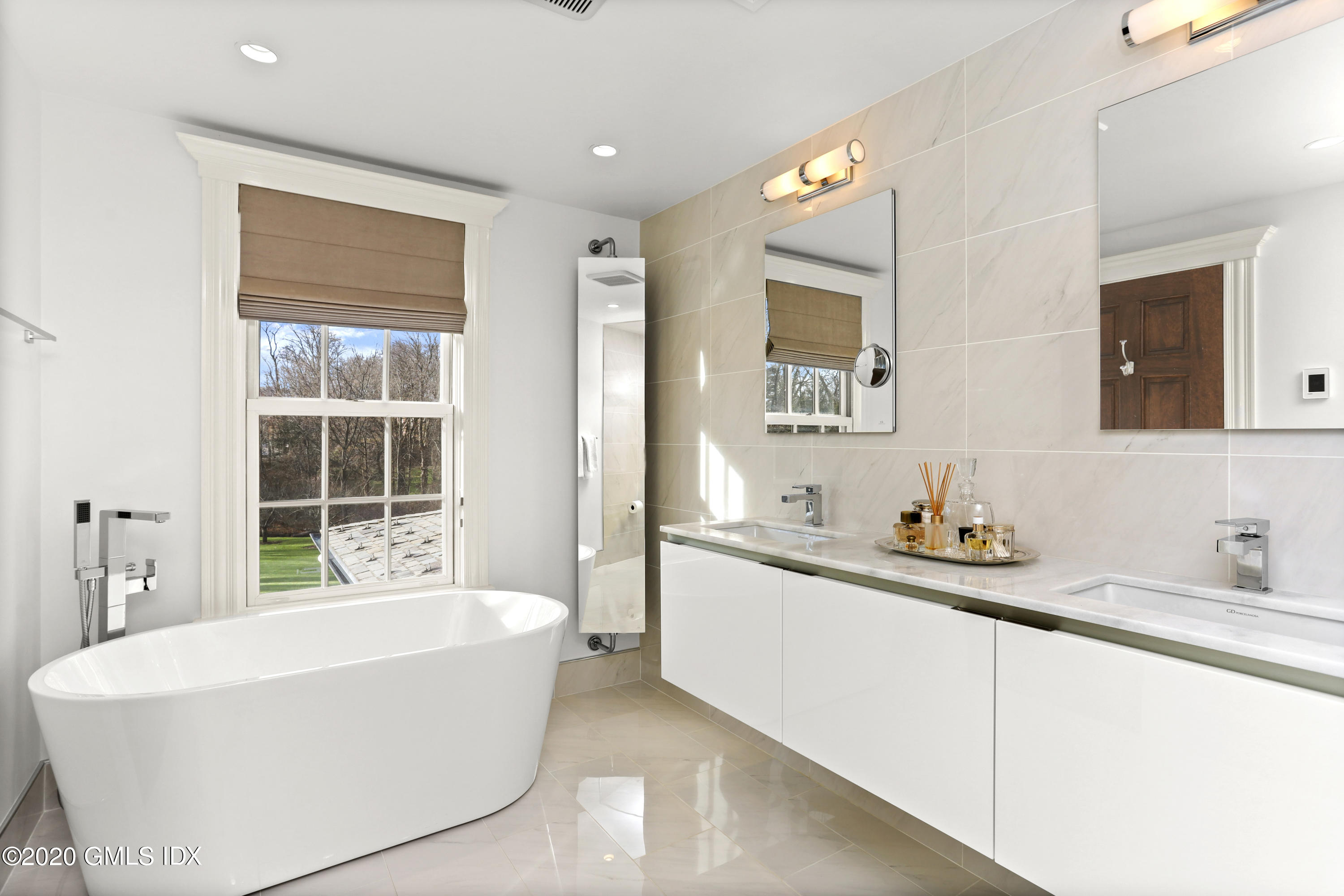 10 Brookridge Drive Greenwich, CT 06830 - Photo 15 of 36 a white bath tub sitting next to a white sink