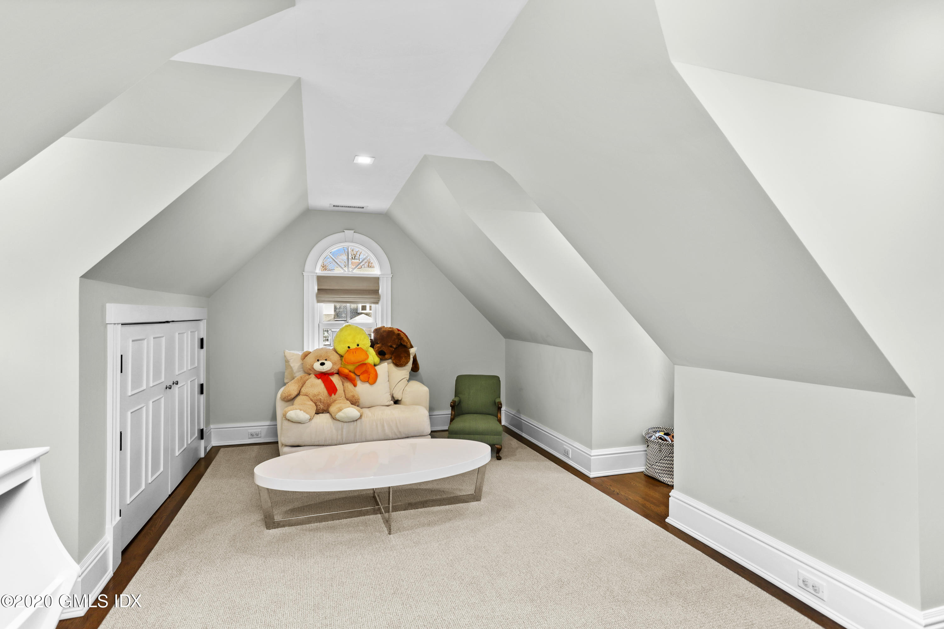 10 Brookridge Drive Greenwich, CT 06830 - Photo 18 of 36 a living room with furniture and a chandelier