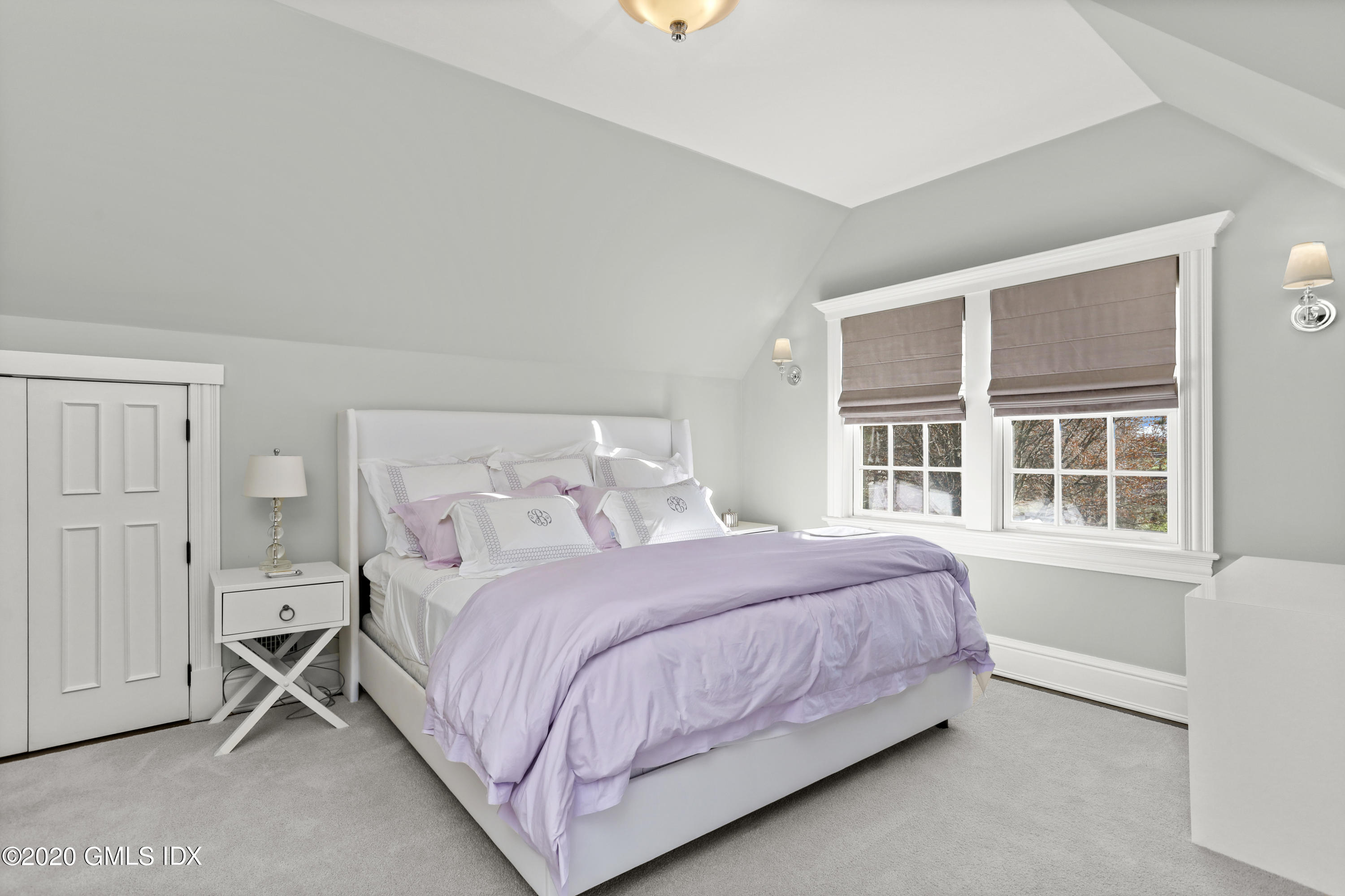 10 Brookridge Drive Greenwich, CT 06830 - Photo 20 of 36 a bedroom with a bed and window