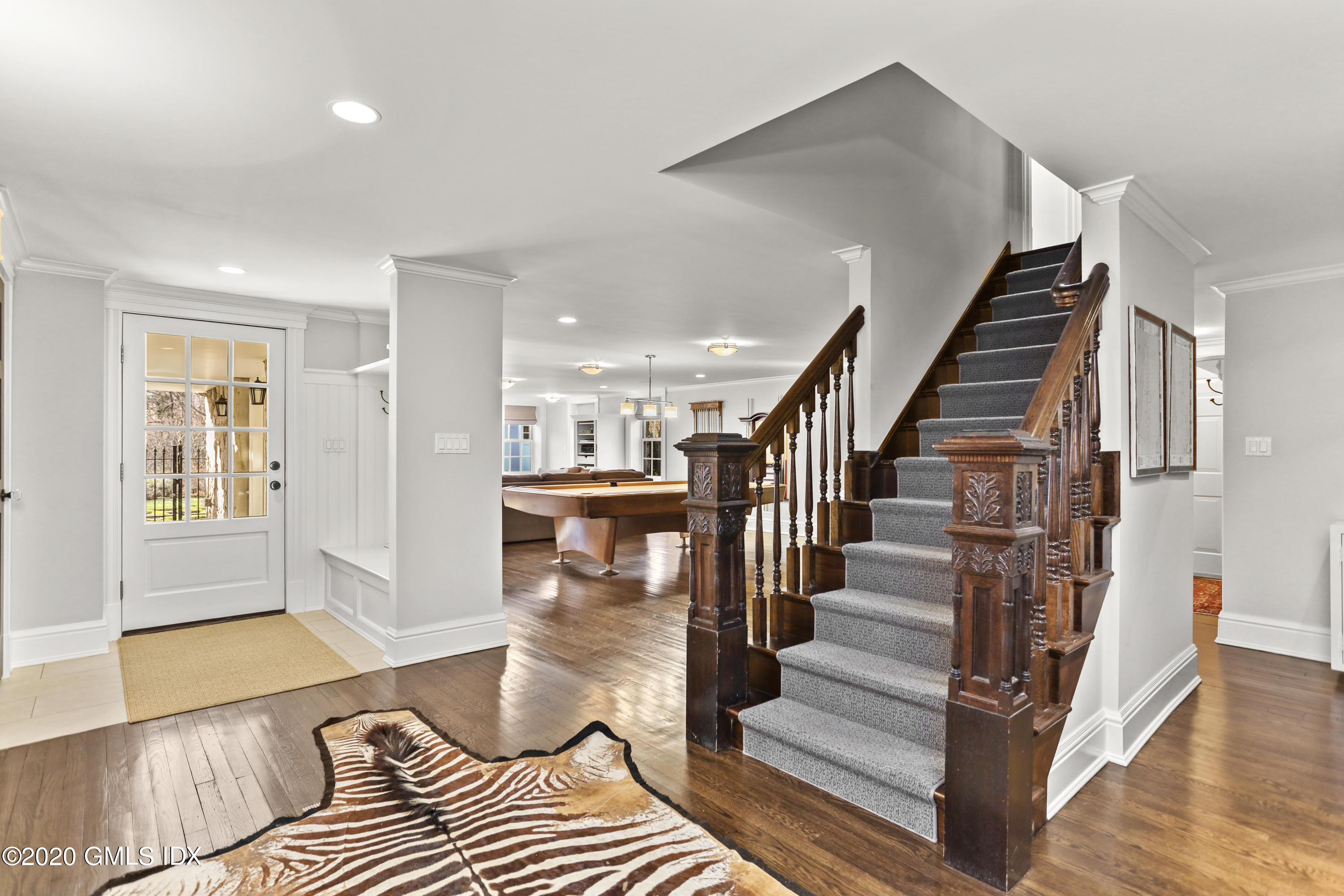 10 Brookridge Drive Greenwich, CT 06830 - Photo 22 of 36 a living room with wooden floor and furniture