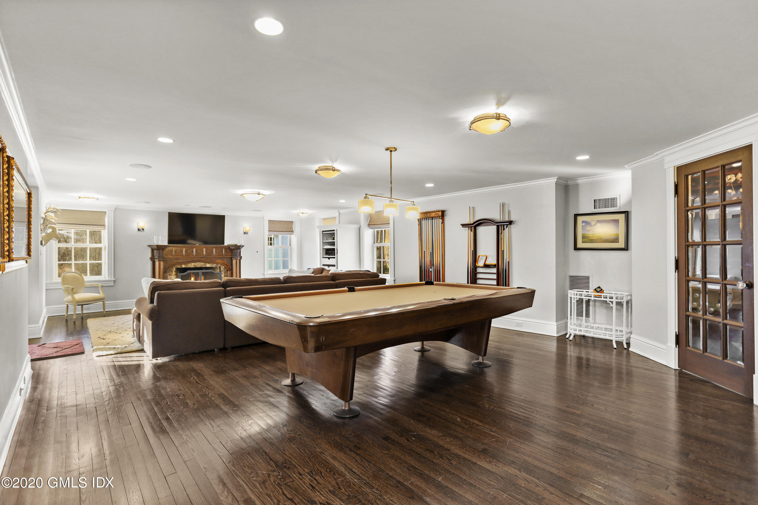 10 Brookridge Drive Greenwich, CT 06830 - Photo 25 of 36 a room with furniture pool table wooden floor and windows