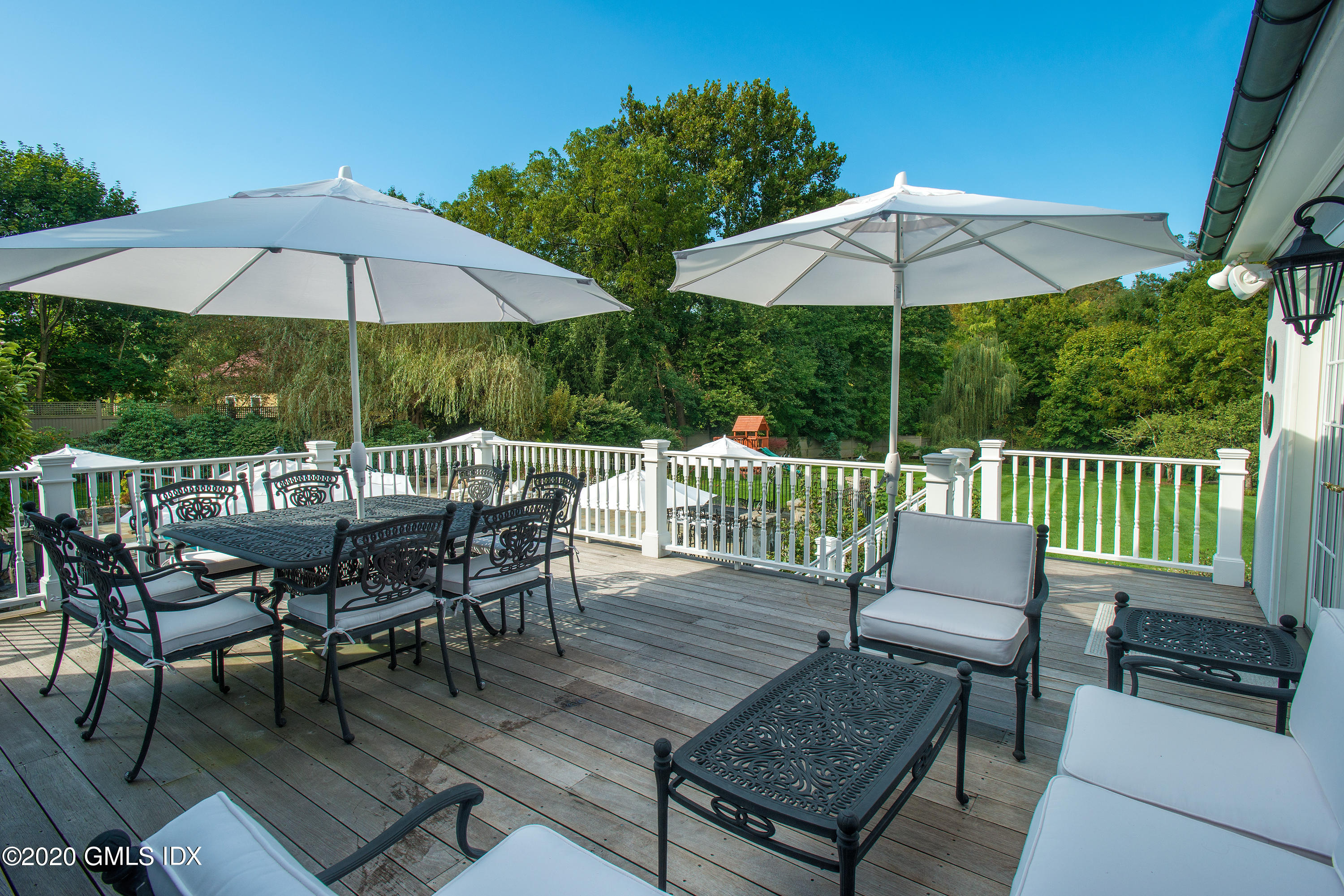 10 Brookridge Drive Greenwich, CT 06830 - Photo 27 of 36 a view of a chairs and table on the deck