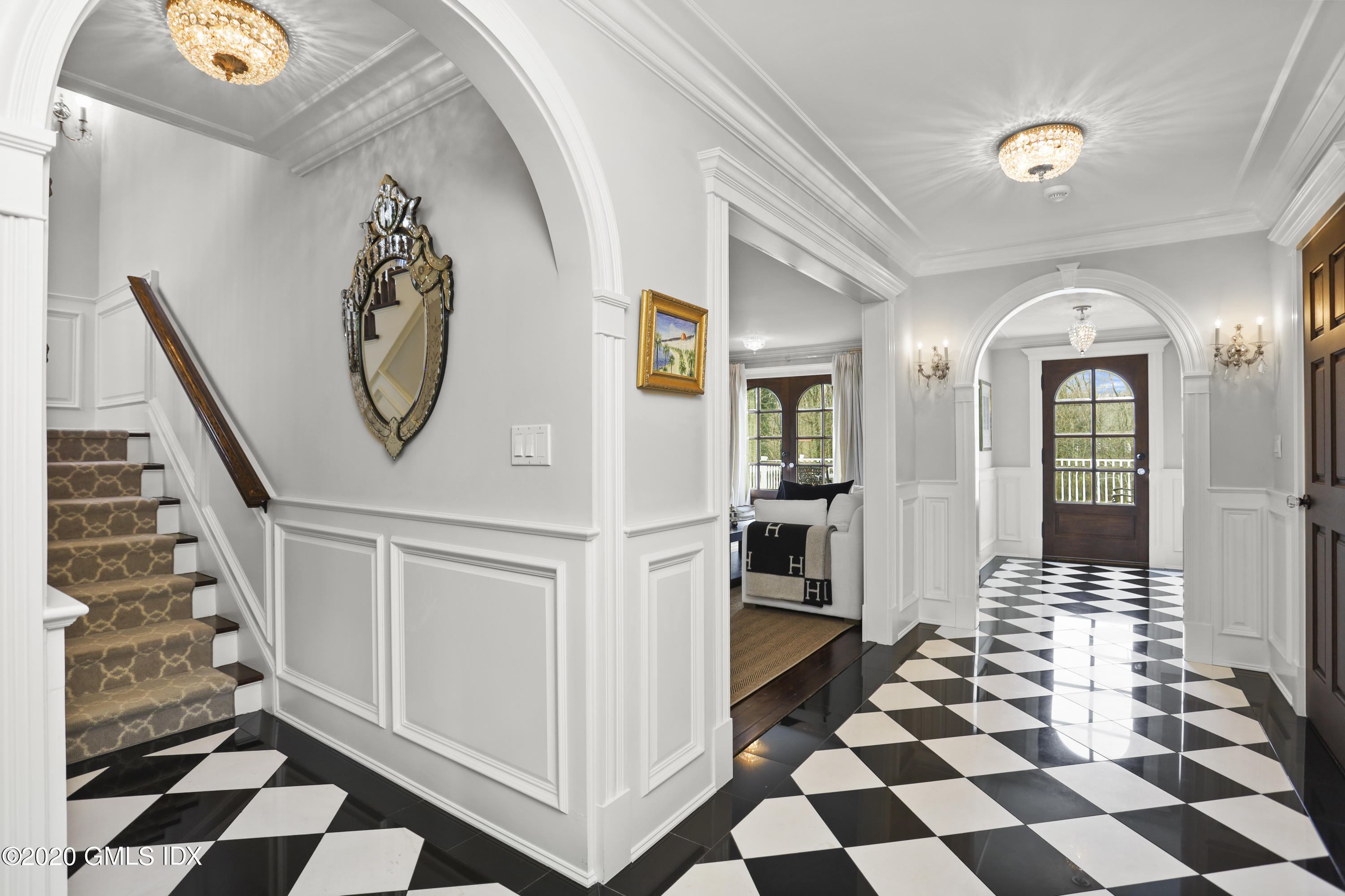 10 Brookridge Drive Greenwich, CT 06830 - Photo 3 of 36 a view of a entryway with a checkered floor and white walls