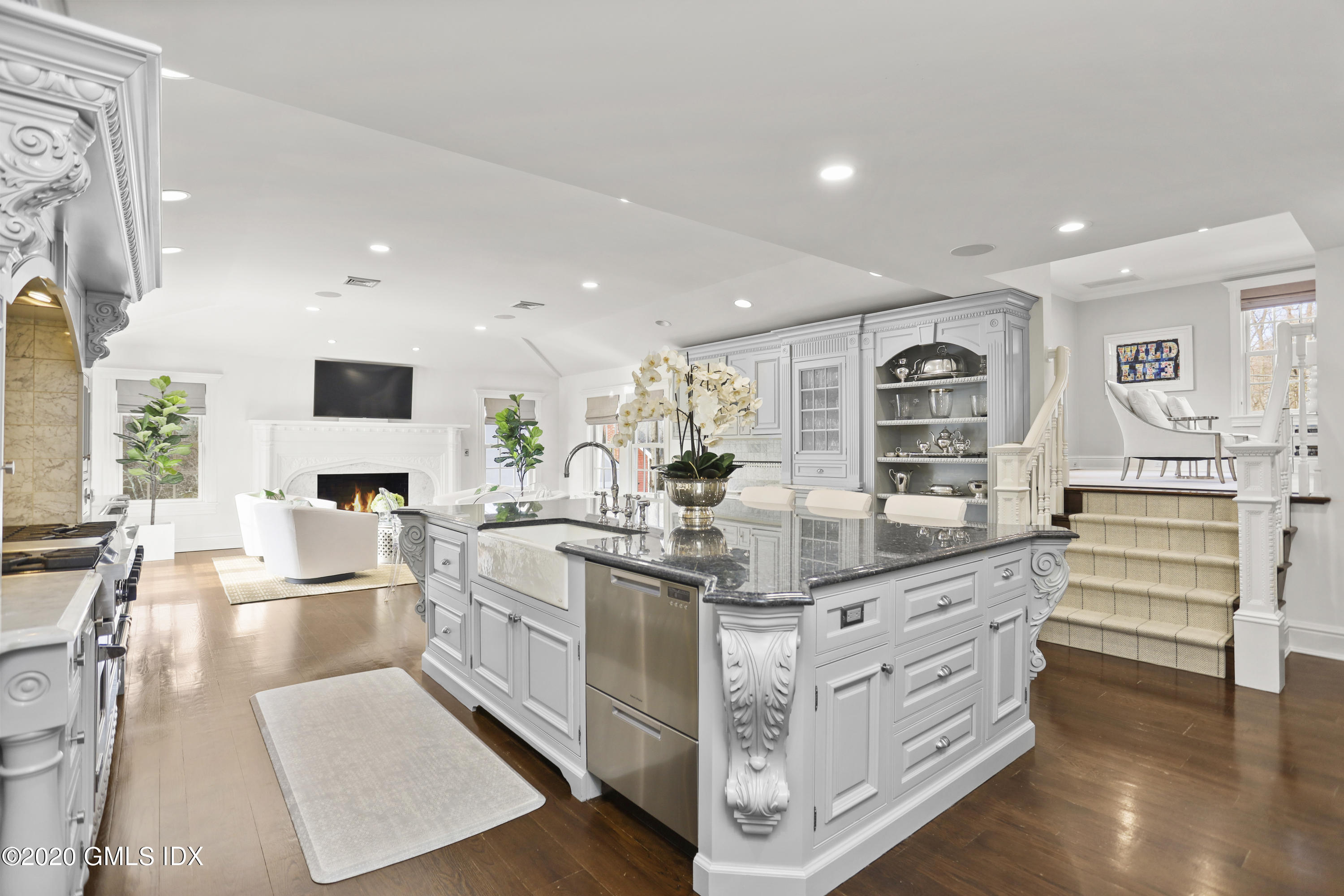 10 Brookridge Drive Greenwich, CT 06830 - Photo 7 of 36 a kitchen with stainless steel appliances kitchen island granite countertop a sink and cabinets