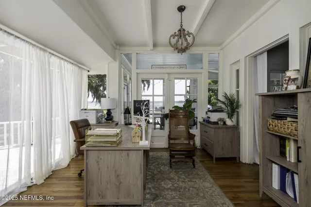 a view of a bedroom with cabinets and wooden floor